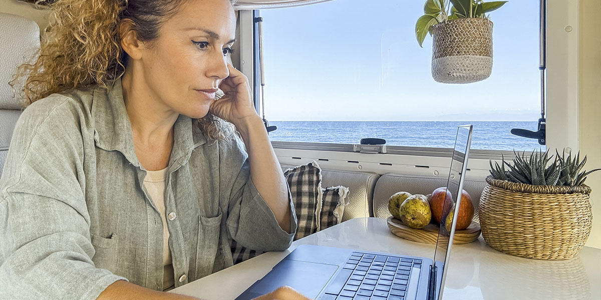 Woman planning route with a map inside an RV