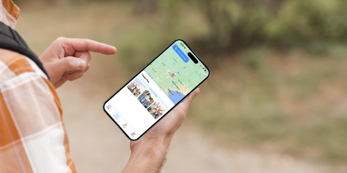 Person using the best RV travel app to navigate a scenic route outdoors.